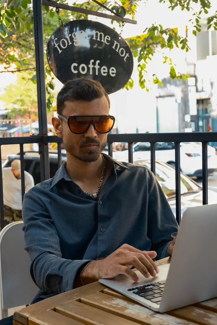 a man writing on a tablet